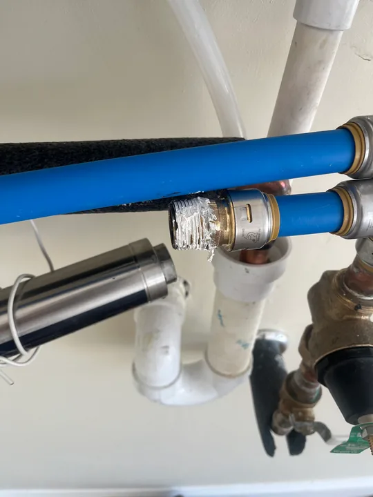 Accessible under-sink trap and supply connections