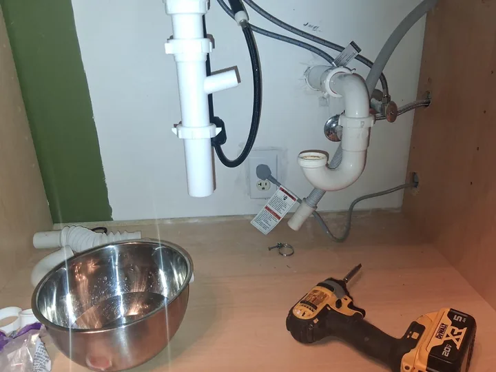 Accessible under-sink trap and supply connections