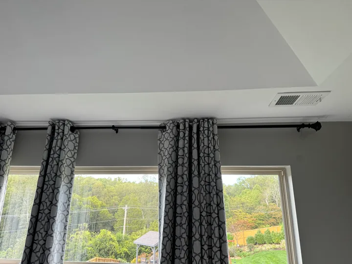 Light painted ceiling, ventilation grille and window trim