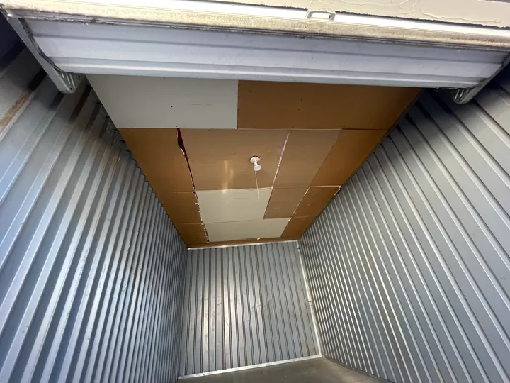 Exposed ceiling framing, support mesh and partial drywall panels