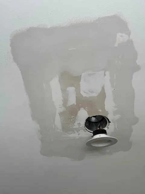 Ceiling patch and joint compound around a light fixture opening