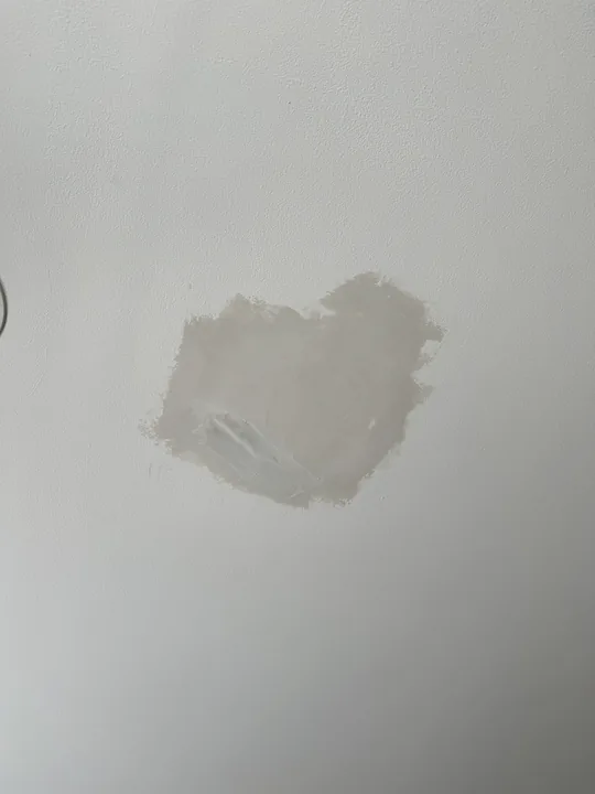 Ceiling patch and joint compound around a light fixture opening
