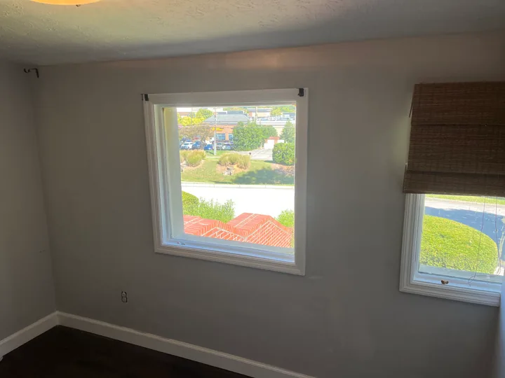 Room windows, ceiling lights and surfaces being prepared for finishing