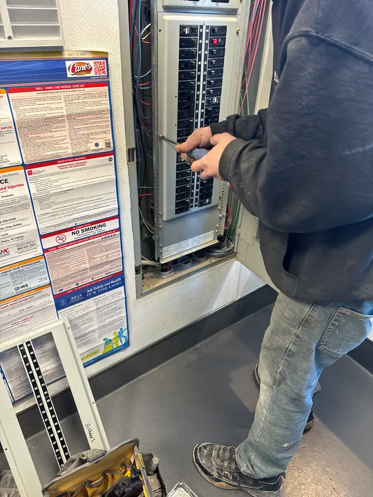 Technician working on a commercial door and frame