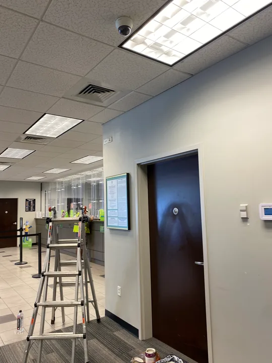 Commercial interior with painted blue walls and a step ladder