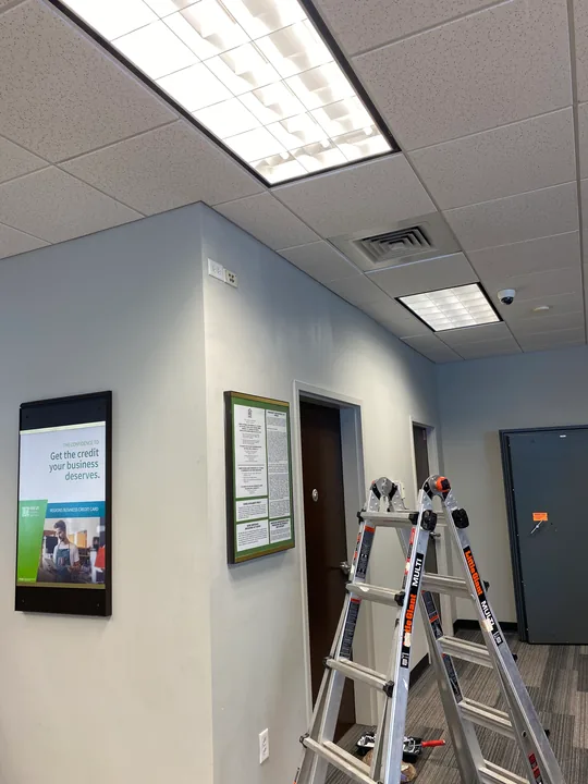 Commercial interior with painted blue walls and a step ladder