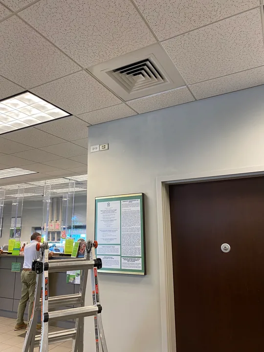 Commercial interior with painted blue walls and a step ladder