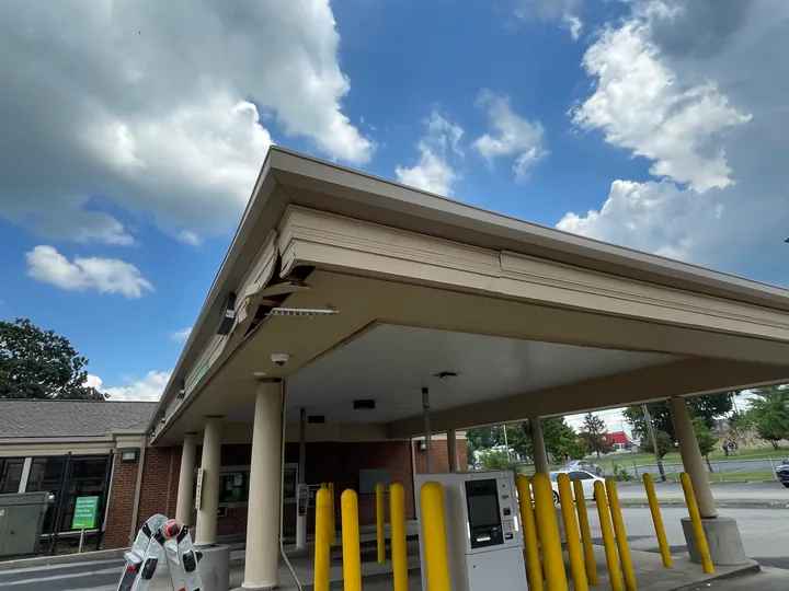Commercial drive-through canopy with fascia, soffit and supporting columns