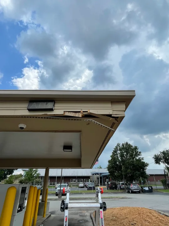 Commercial drive-through canopy with fascia, soffit and supporting columns