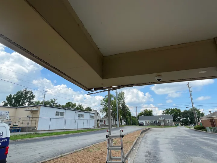 Commercial drive-through canopy with fascia, soffit and supporting columns