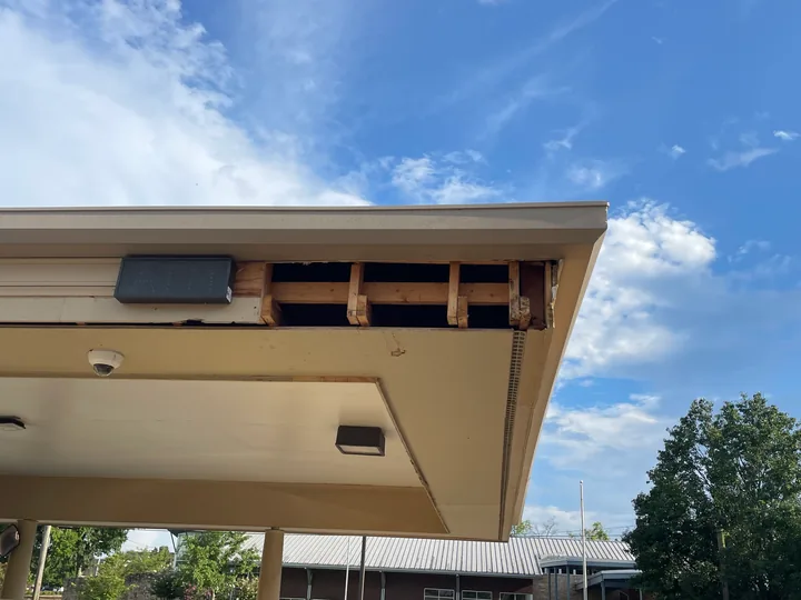 Commercial drive-through canopy with fascia, soffit and supporting columns