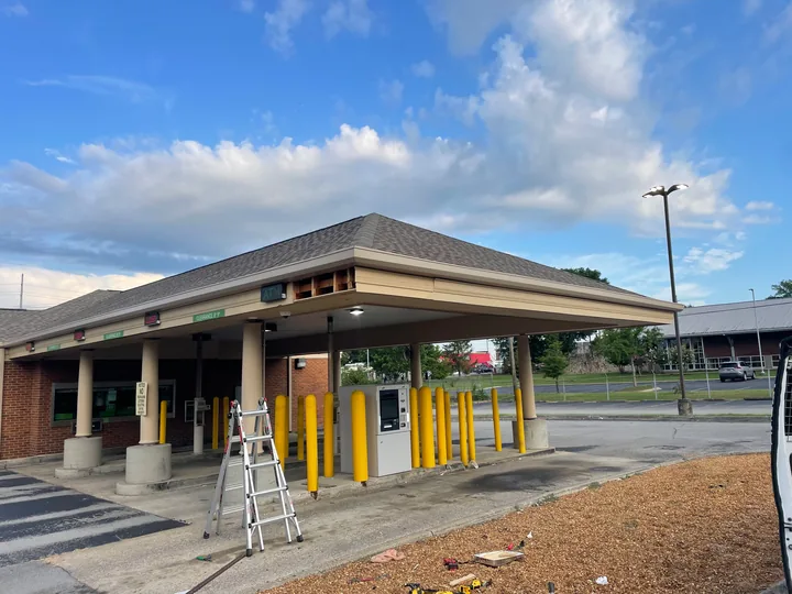 Commercial drive-through canopy with fascia, soffit and supporting columns