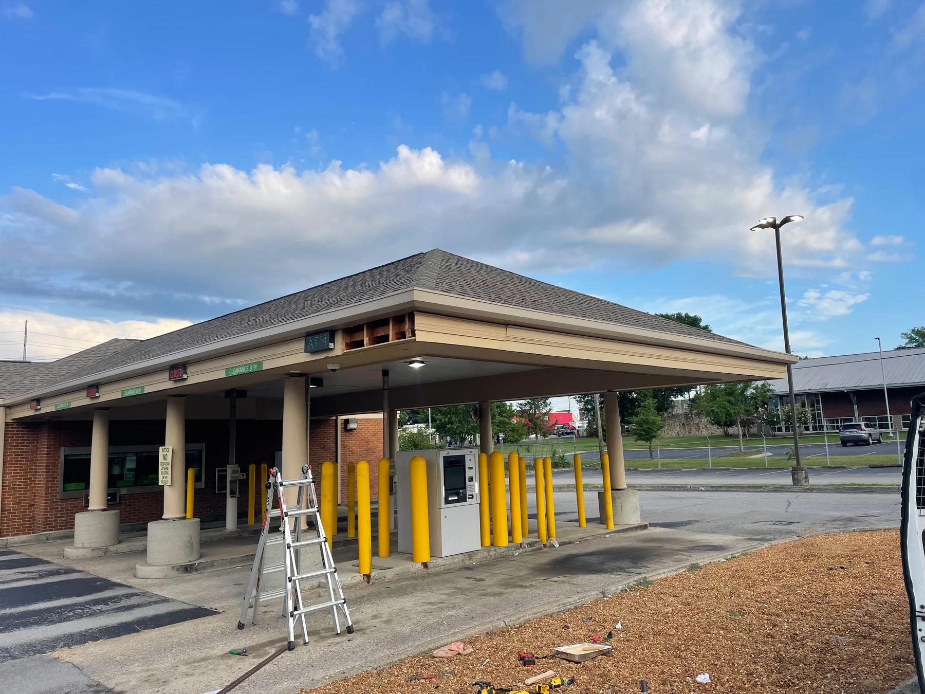 Commercial drive-through canopy with fascia, soffit and supporting columns