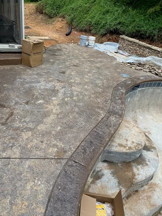 Curved paver border and low masonry retaining wall