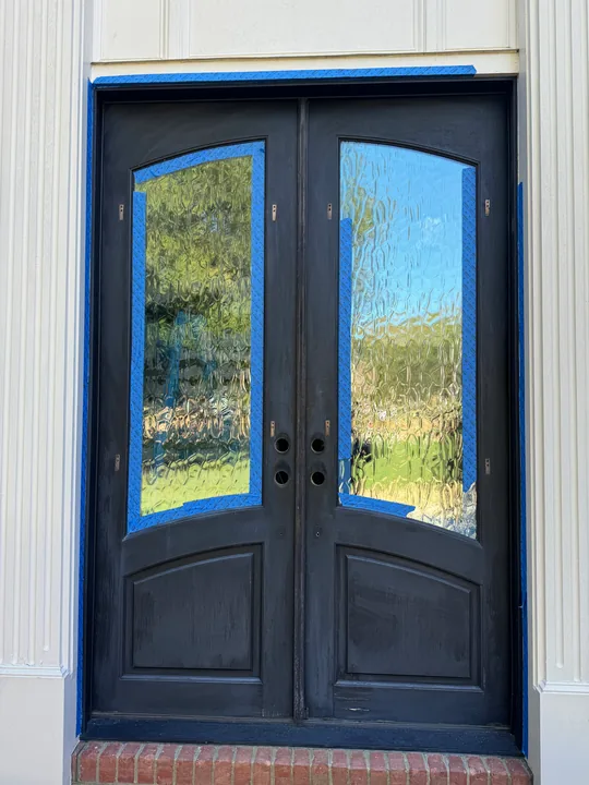Dark double patio doors with divided glass panels