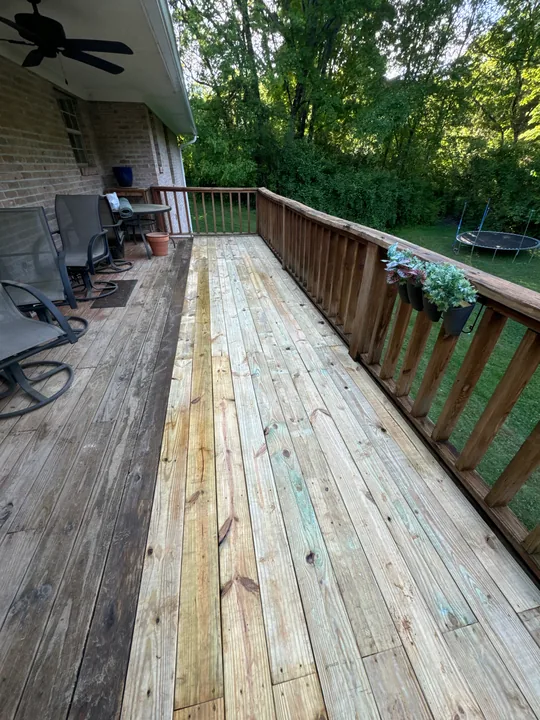 Exterior deck with weathered boards, timber stairs and railing