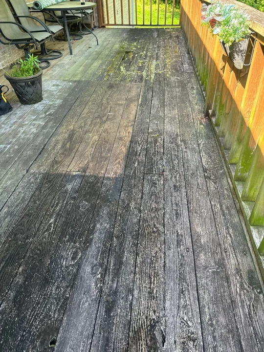 Exterior deck with weathered boards, timber stairs and railing