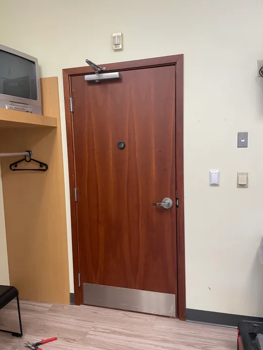 Commercial wood door, lever handle and hinge connection