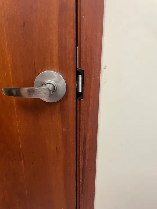 Commercial wood door, lever handle and hinge connection