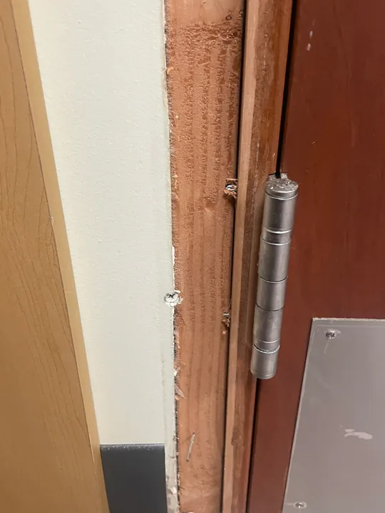 Commercial wood door, lever handle and hinge connection