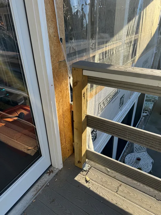 White double glass doors beside a room undergoing renovation