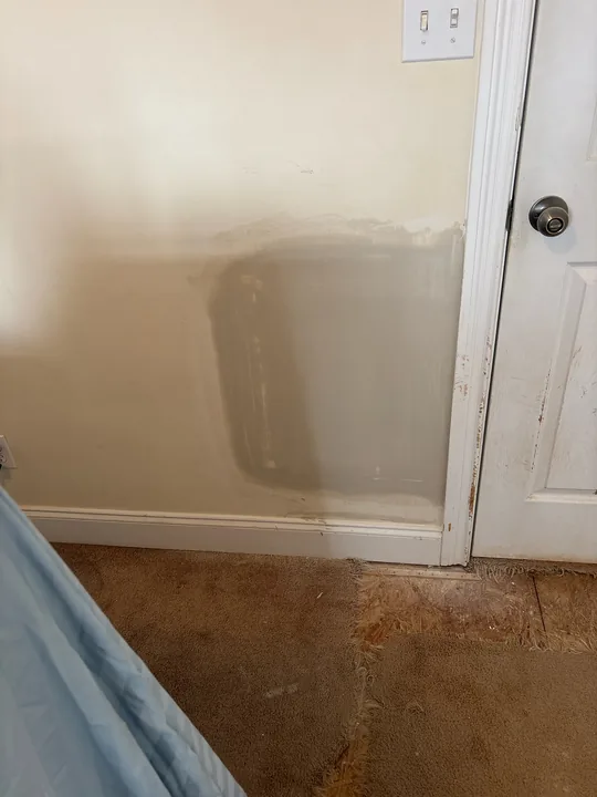 Drywall joint compound and wall repairs around a doorway