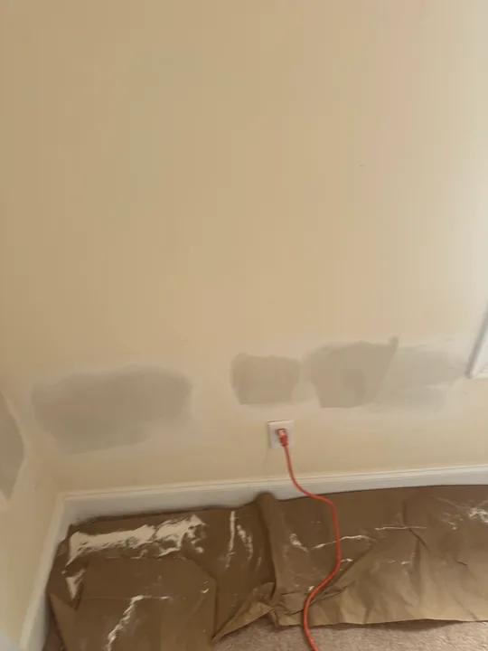 Drywall joint compound and wall repairs around a doorway