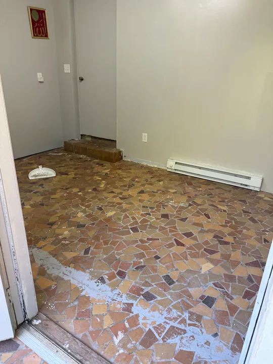 Gray plank flooring, subfloor preparation and light room walls