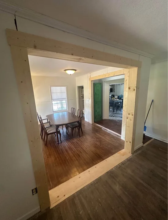 Wood flooring through a light interior and doorways