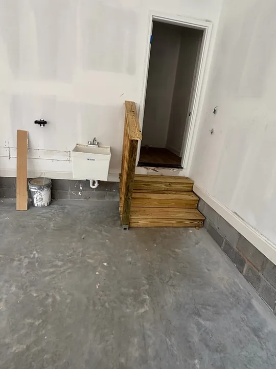 Small timber steps at an interior doorway