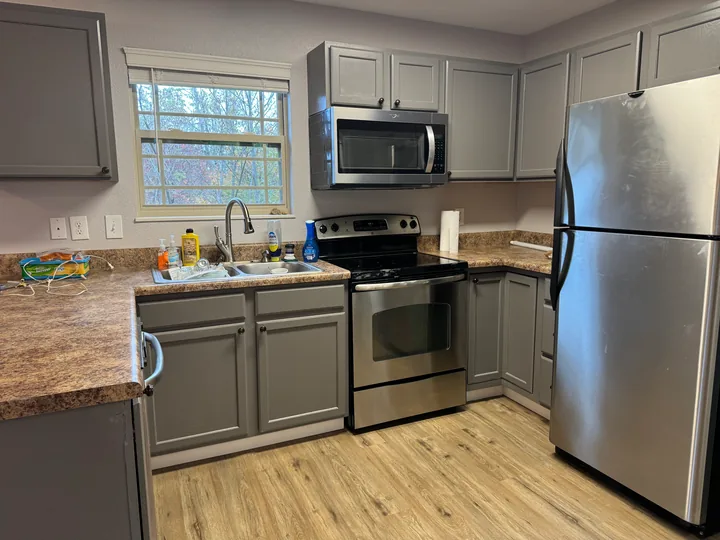 Wood-look kitchen flooring around cabinets and appliances