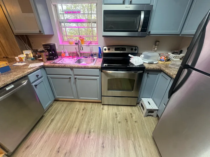 Wood-look kitchen flooring around cabinets and appliances