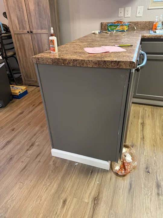 Wood-look kitchen flooring around cabinets and appliances