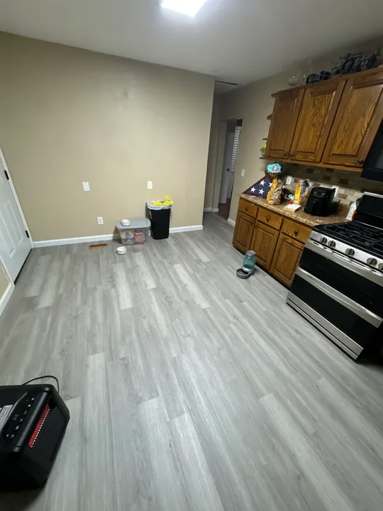 Kitchen floor preparation and wood-look plank flooring