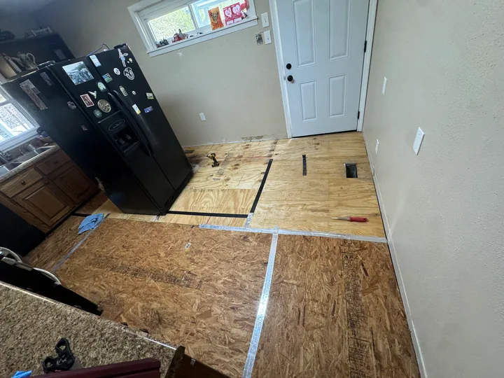 Kitchen floor preparation and wood-look plank flooring
