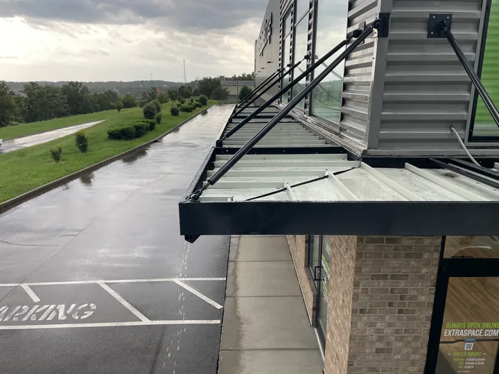Metal commercial canopy with support frame and connection hardware