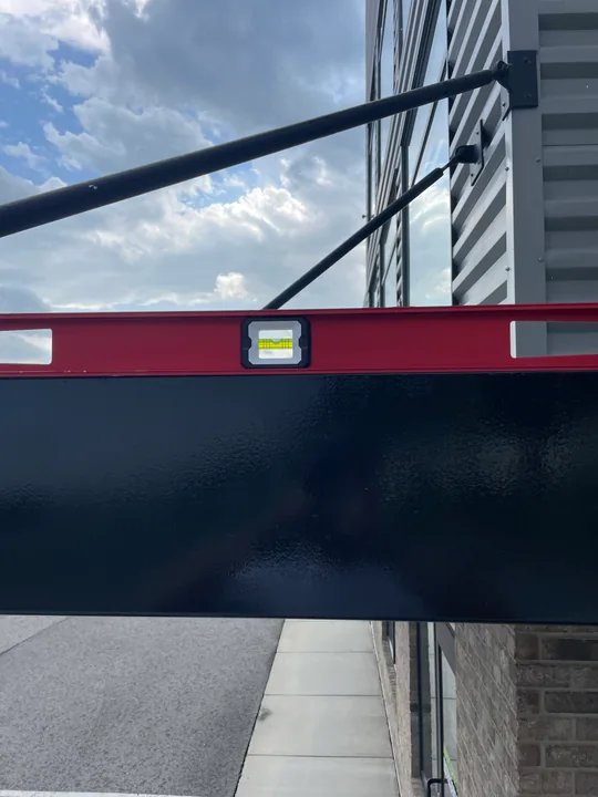 Metal commercial canopy with support frame and connection hardware
