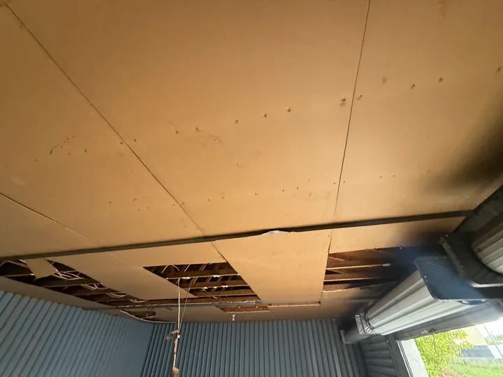 Vertical metal wall panels inside a small commercial room