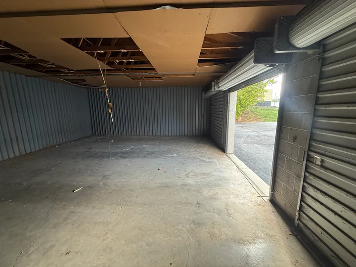 Vertical metal wall panels inside a small commercial room