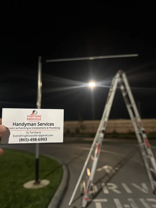 Outdoor light poles illuminating a parking area at night