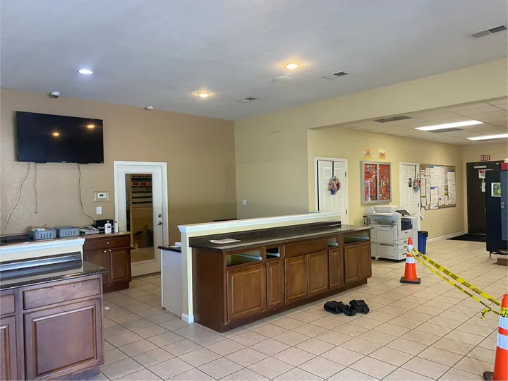 Commercial counter area beside interior partitions and ceiling lights