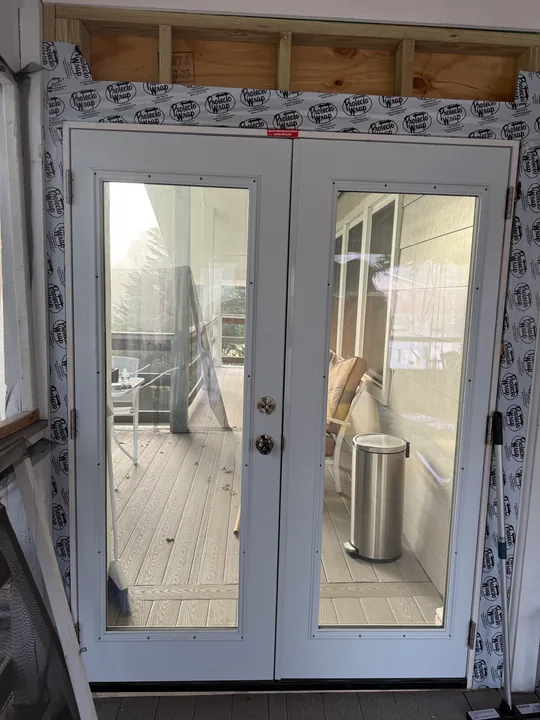 Glass patio door, threshold and surrounding trim