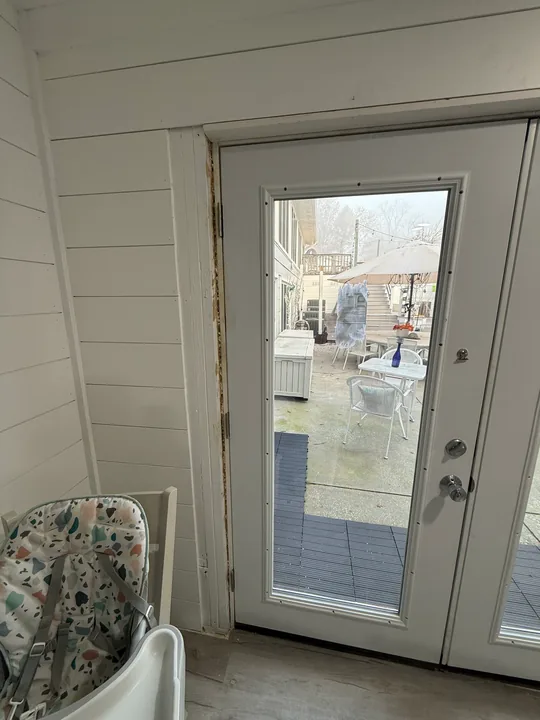 Glass patio door, threshold and surrounding trim