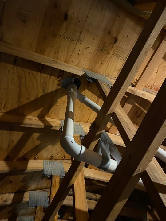 Drain and supply pipework beneath timber floor framing