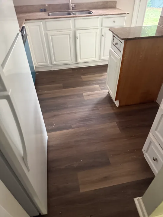 Wood-look plank flooring through rooms and doorways