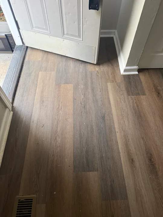 Wood-look plank flooring through rooms and doorways