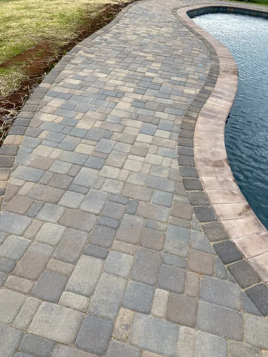 Paver patio, pool edge and covered outdoor structure