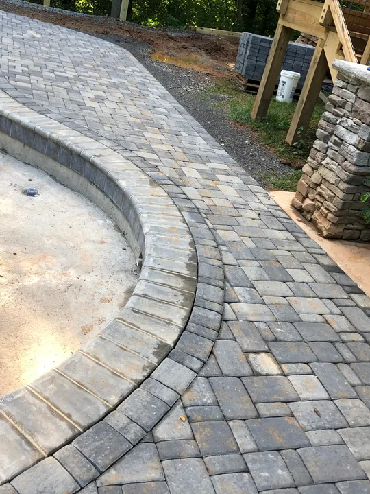 Paver patio, pool edge and covered outdoor structure