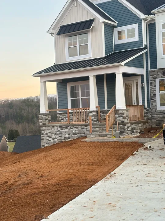 Home exterior with timber porch framing, columns and entry steps