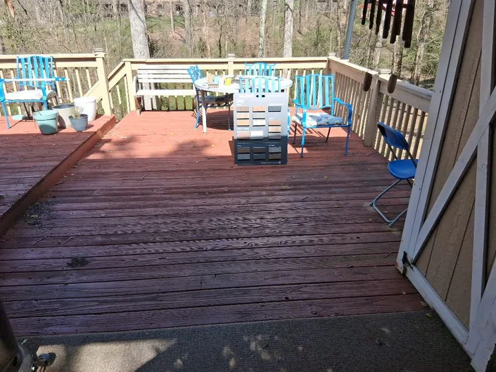 Red-stained deck, railing and exterior timber stairs